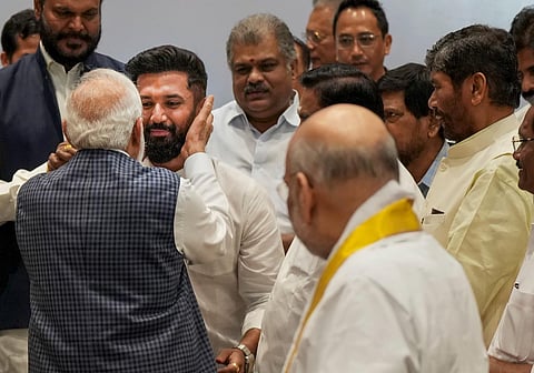 Prime Minister Narendra Modi exchanges greetings with LJP (Ram Vilas) chief Chirag Paswan during the meeting of the National Democratic Alliance (NDA). (Photo | PTI)