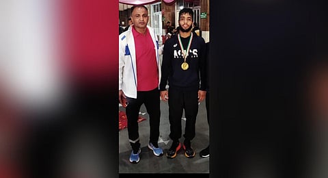 Coach Dayanand Kalkal with his son Sujeet (R) (Photo|Special arrangement)