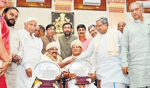 Chief Minister Siddaramaiah felicitates Srikantegowda and SR Patil, the winners of the ‘Best Legislator Award’, at Vidhana Soudha in Bengaluru on Tuesday | Express
