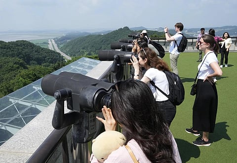 Visitors watch the North Korea side from the Unification Observation Post in Paju, South Korea, near the border with North, July 19,2023. (Photo | AP)