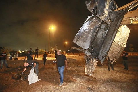 Israeli authorities inspect the remains of what the military said is a Syrian anti-aircraft rocket that exploded in the air, in the town of Rahat, Israel, Sunday, July 2, 2023. (Photo | AP)