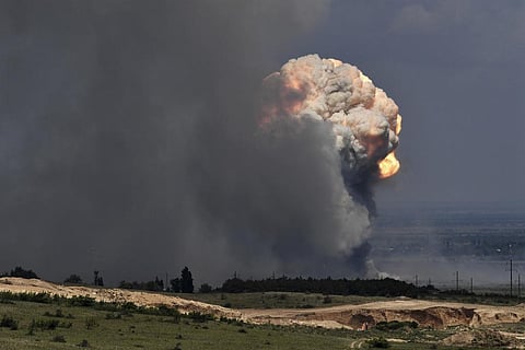 A plume of smoke rises over an ammunition depot where explosions occurred at the facility in Kirovsky district in Crimea, Wednesday, July 19, 2023. (Photo | AP)