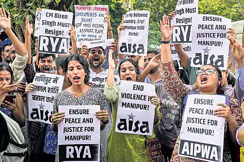 Members of various organisations stage a protest against the ongoing ethnic violence in Manipur. (Photo| PTI)