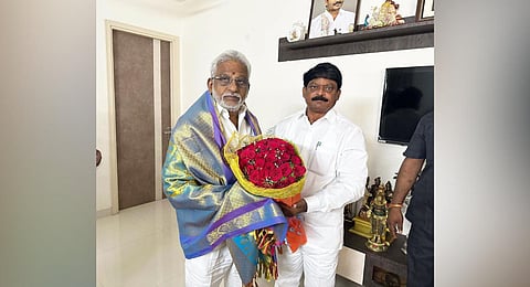 DCCB Chairman Kola Guruvulu with YSRC regional coordinator YV Subba Reddy in Vizag on Friday | express