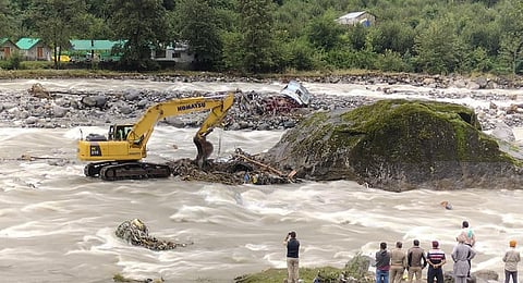 Police during a search and rescue operation for missing persons in the Beas river, in Kullu district, Sunday, July 23, 2023.(Photo | PTI)
