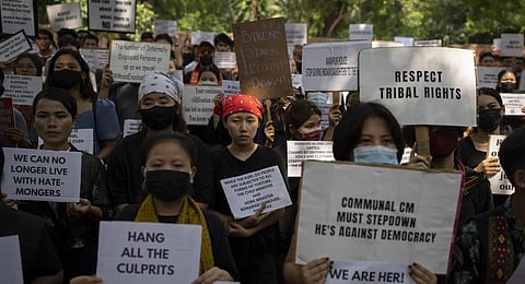 Kuki tribal protestors, in New Delhi, shout slogans during a demonstration against deadly ethnic clashes in Manipur, on Saturday, July 22, 2023. (Photo | AP)