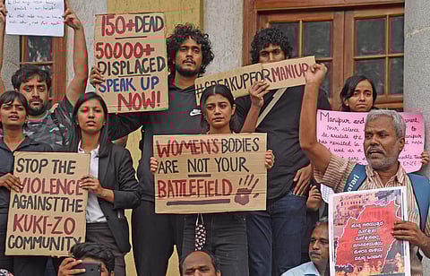 Students and activists protest seeking resolution of ethnic violence in Manipur, in front of Town Hall on Friday. (Photo | Vinod Kumar T)