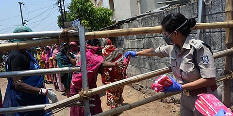 In this April 2020 representational image, free sanitary napkins being distributed by Commisionrate Police at containment zone of Surya Nagar in Bhubaneswar. (Photo | EPS)
