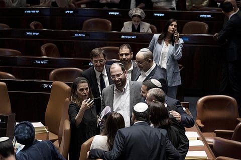 Israeli lawmakers celebrates after approving a key portion of Netanyahu's Judicial Overhaul.