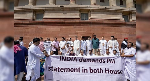 AAP MP Sanjay Singh with other leaders of the INDIA alliance parties stages a protest over ethnic violence in Manipur. (Photo | PTI)