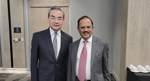 India's National Security Advisor (NSA) Ajit Doval meets with Chinese diplomat Wang Yi in Johannesburg on Monday. (Photo | MEA)