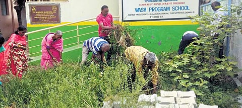 The councillor and locals got their hands dirty this week, clearing out a portion of overgrown bushes that found home at a corporation middle school toilet in Ramanathapuram, Tiruvottiyur.