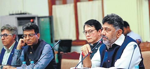 DyCM DK Shivakumar addresses a press meet, as World Design Organisation president David Kusuma (second from right) and BBMP Chief Commissioner Tushar Girinath (second from left) look on, in Bengaluru