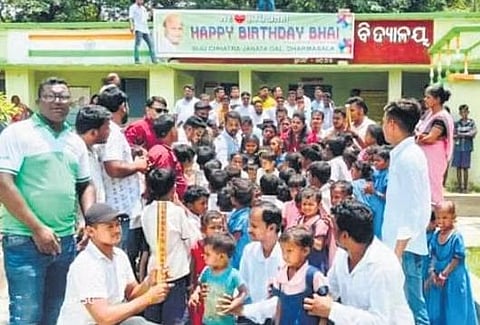 Supporters of MLA Pranab Balabantaray celebrating with school students