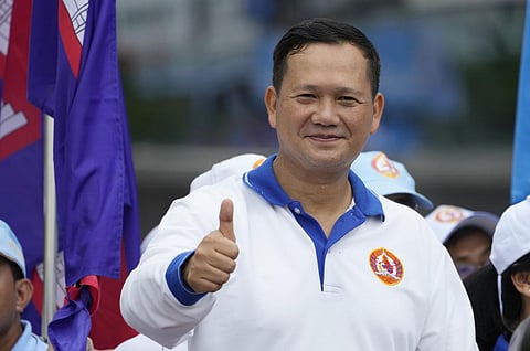 Hun Manet shows a thumbs-up as he leads a procession to mark the end of an election campaign of the Cambodian People's Party, in Phnom Penh, Cambodia, Friday, July 21, 2023. (Photo | AP)