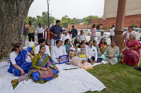 AAP MP Sanjay Singh with NCP MP Supriya Sule, TMC MP Dola Sen and other opposition MPs at Parliament House complex demanding PM Modi's statement on Manipur crisis. (PTI)