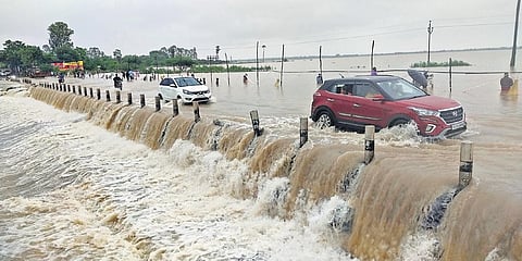 The Katakshapur lake in Atmakur mandal of Hanamkonda district flows over the National Highway 163, between Hyderabad and Bhupalpatnam, affecting vehicular traffic on Wednesday.