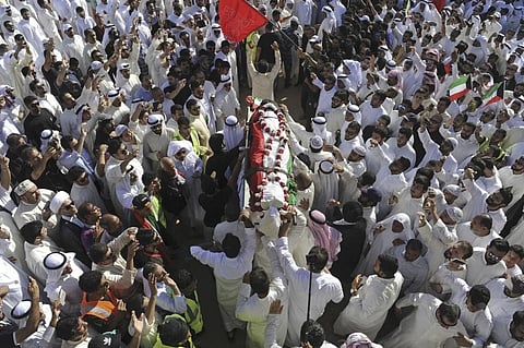 Thousands of Sunnis and Shiites take part in a mass funeral procession for 27 people killed in a suicide bombing at the Grand Mosque in Kuwait City on June 27, 2015. (File Photo | AP)