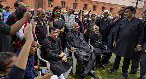 AAP MP Sanjay Singh with Leader of Opposition in Rajya Sabha Mallikarjun Kharge and other opposition MPs during a protest in Parliament. (Photo | PTI)