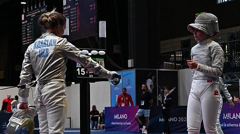 Ukraine's Olha Kharlan (L) refuses to shake hands after beating Russian fencer Anna Smirnova, competing as a neutral at the Fencing World Championships in Milan. (Photo | AFP)