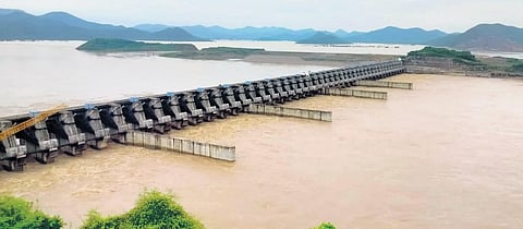 With Godavari in spate, around 8 lakh cusecs of floodwater was discharged from Dowleswaram Barrage on Wednesday | Express