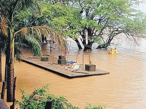 The fully submerged Gandi Pochamma temple in Godavari floods in Devipatnam mandal of ASR district on Thursday | Express