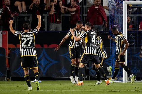Juventus FC defender Luiz Da Silva Danilo celebrates with teammates after scoring during the first half of a club-friendly soccer match against AC Milan. (Photo | AP)