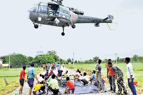 IAF chopper airdrops food and water to the residents of Kondai and Malyal villagers in Mulugu district on Friday