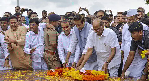 NCP Chief Sharad Pawar with Congress leader Prithviraj Chavan pays tribute to former Maharashtra chief minister Yashwantrao Chavan, in Karad, Monday, July 3, 2023. (Photo | PTI)
