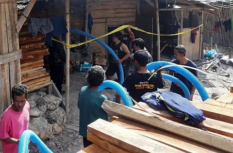 Rescue workers insert a hose to extract water from an illegal gold mining pit at Pancurendang village in Banyumas, on July 26 in an effort to rescue eight miners trapped underground. (Photo: AFP)