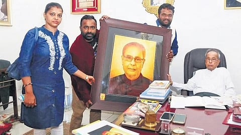 Ramanjaneya Reddy presenting portraits to former President Pranab Mukherjee | Express