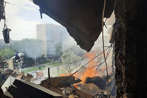 Emergency services work at a scene after a missile hits a multi-story apartment building in Kryvyi Rih, Ukraine. (Photo | AP)
