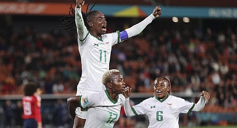 Goal scorer Zambia's Racheal Kundananji carries teammate Barbra Banda as they celebrate their third goal during the Women's World Cup Group C soccer match between Costa Rica and Zambia. (Photo | AP)