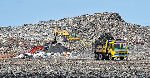 Bio-mining works in progress at the Ariyamangalam dump yard in Tiruchy | mk ashok kumar