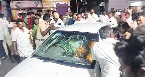 The car in which BJP supporters came was allegedly attacked by DMK functionaries in Pavoorchatram | Express