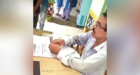  Screen grab of the video showing Behera taking money | EXPRESS 