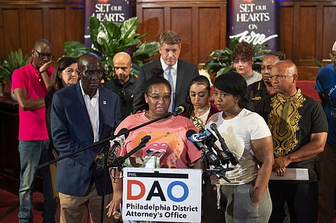Josephine Wamah, center left, with Jasmine Wamah, center right, sisters of shooting victim Joseph Wamah Jr., speaks about their brother at a news conference in Philadelphia. (Photo | AP)