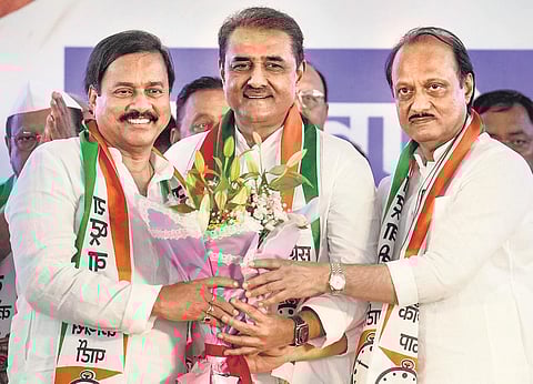 Maharashtra Deputy Chief Minister Ajit Pawar (R) with NCP leaders Praful Patel (C) and Sunil Tatkare (L) during a meeting in Mumbai on Wednesday | PTI