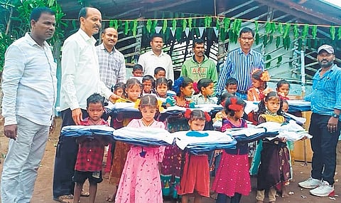 Tribal children at the newly opened Sabari Girijana Vidyasram at Jajulabandha hilltop village in Koyyuru mandal in ASR district on Thursday. (Photo | Express)