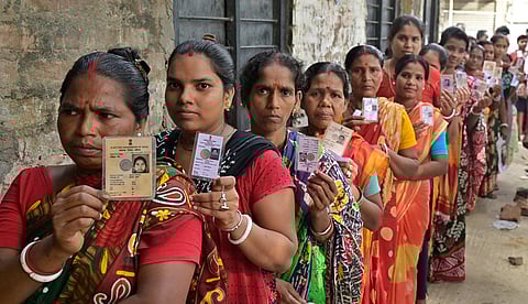 People stand in queue to cast their votes for Panchayat elections at a polling station, in Nadia district (Photo | PTI)