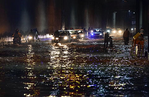 New Delhi: Vehicles make their way under a waterlogged underpass following heavy monsoon rains, near Appolo hospital, Okhla, in New Delhi, Saturday, July 8, 2023. (Photo | PTI)