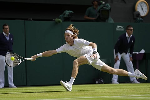 Russia's Andrey Rublev returns to Kazakhstan's Alexander Bublik at Wimbledon, July 9, 2023. (Photo | AP)