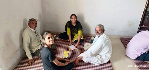Sowing Hard Work, Reaping Smiles: Kalpana Gurjar and Vidya Patel with their fathers.