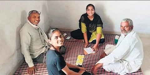 Kalpana Gurjar and Vidya Patel play cards with their fathers in Raibidpura