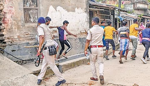 Police personnel baton charge after a clash between rival groups during panchyat elections, at Nagaria village in Malda district of Bengal on Saturday. (File photo | PTI)