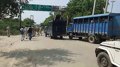 Police personnel deployed after a clash erupted between two groups in Haryana's Nuh on Monday. (Photo | ANI)