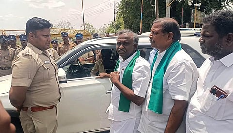 The functionaries, who were there to inspect farmlands affected by works on NLCIL coal mine, were stopped by the police at Sethiyathope Cross Road.