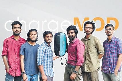 The team members of ChargeMOD with their electric vehicle charging equipment