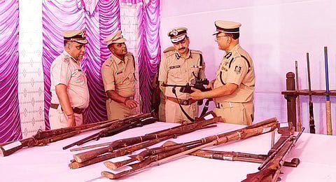 DGP Sunil Bansal looking at the seized firearms and ammunition. (Photo | Express)