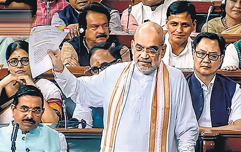 Union home minister Amit Shah makes his intervention in the discussion on the motion of no-confidence in the Lok Sabha, in New Delhi on Wednesday. (Photo | PTI)